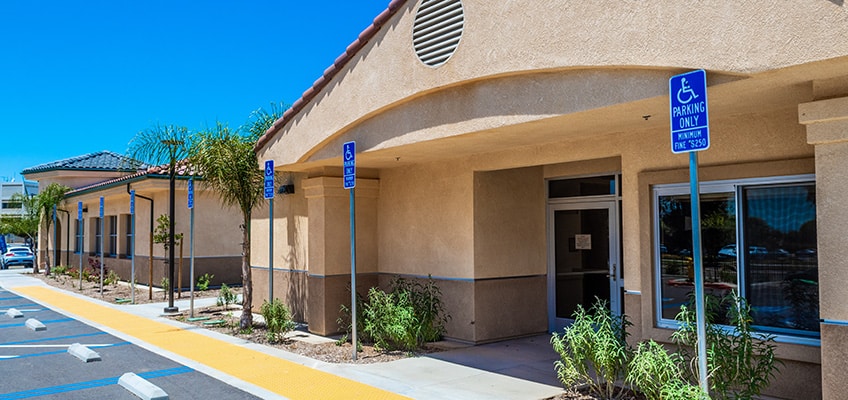 Entrance to the building with handicapped parking out front.
